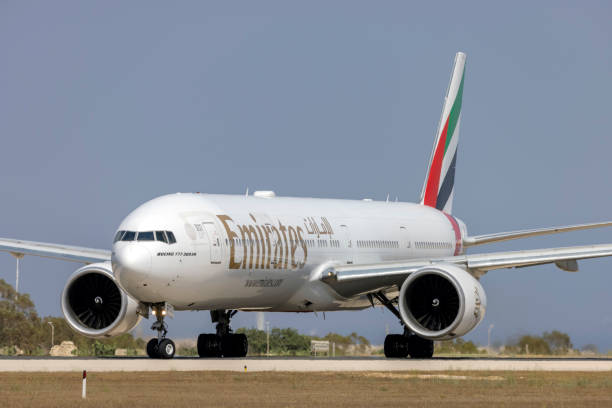 Boeing 777 on the runway prior take off Luqa, Malta - July 14, 2021: Emirates Boeing 777-31H (REG: A6-EPT) taxing for take off, restarted flights to Malta after COVID19 restriction were eased. ept stock pictures, royalty-free photos & images