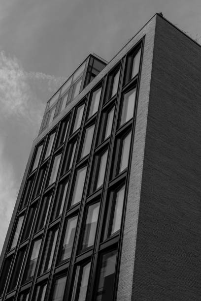 istock Modern apartment building with clouds in the sky 1332158238