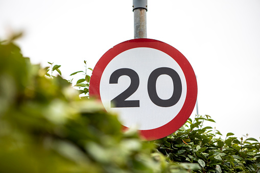Ministry of Transport UK speed limit road sign indicating maximum speed of 20mph allowable.
