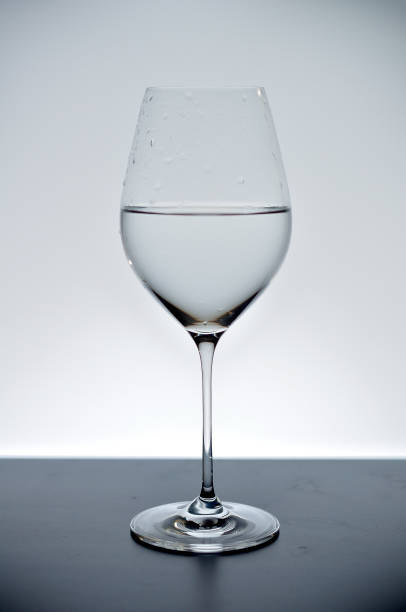 istock wineglass filed with water in black and white 1332160111