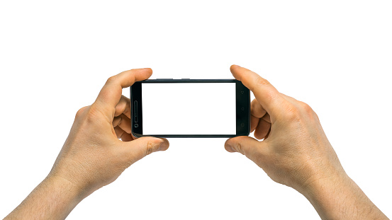 Man with left and right hand holding a mobile smartphoneisolated on white background with clipping path for the screen.Two hands holding a smartphone.