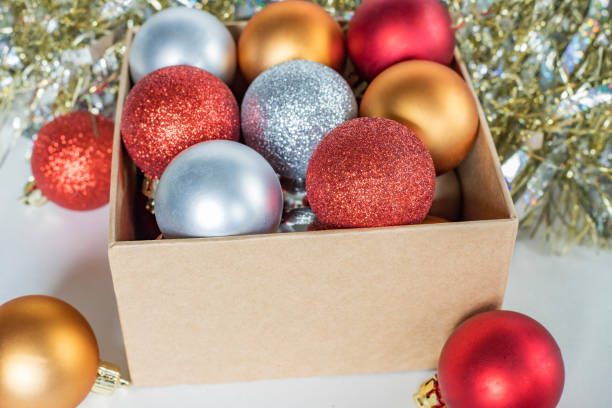 istock Christmas and New Year decorations in box on white background. Christmas tree balls. 1332166506