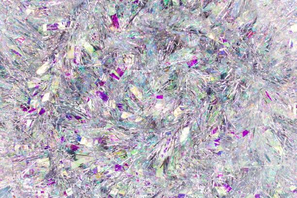 istock Christmas background with tinsel. Silvery background and beautiful bokeh. 1332170780
