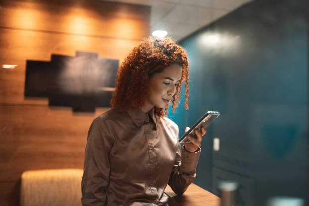 Young woman using smart phone stock photo