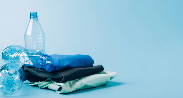 istock Polyester fiber synthetic fabrics eco-friendly textile recycled recyclable plastic bottles. Reuse recycling used bottles 1332170975