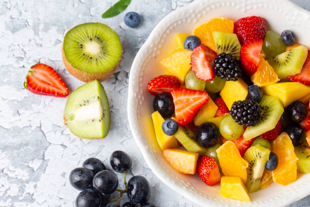istock Dietary fruit salad with fresh summer fruits 1332171645