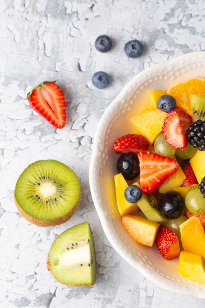 istock Dietary fruit salad with fresh summer fruits 1332172073