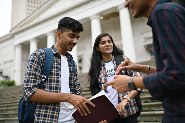 istock Students standing and talking in the University campus 1332172816