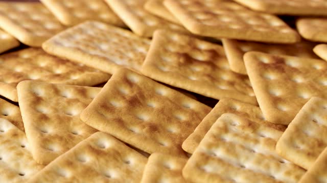 Background of stacked salty cracker cookies, close up