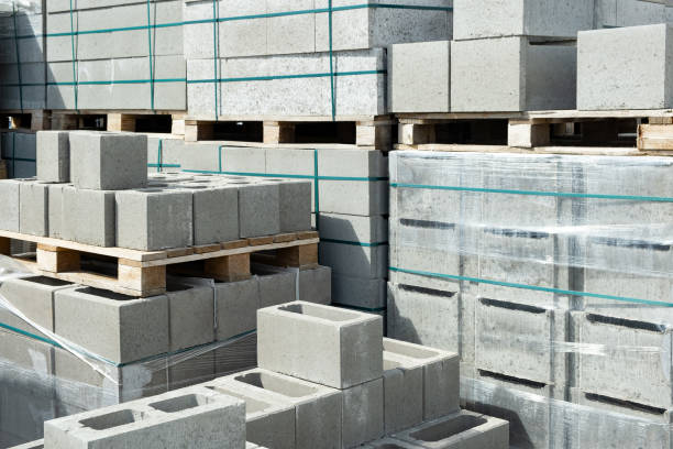 istock Stack of cement concrete Building cinder blocks brick  on pallete in hardware store 1332177937
