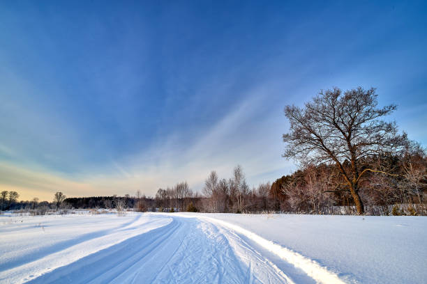 istock Snow covered road or skiing on a winter sunny day. 1332179394