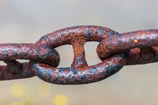 Old chain against blurred backdrop background