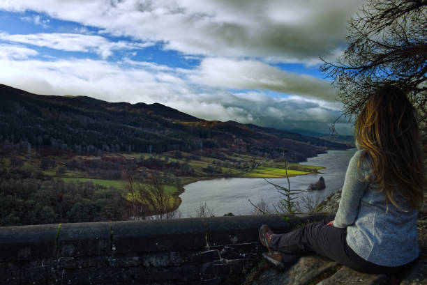 The Queen's View is an amazing viewpoint looking up Loch Tummel to Schiehallion. People generally sit on the rock for a couple of minutes or maybe hours to admire the magnificent nature that appears in front of their eyes.
