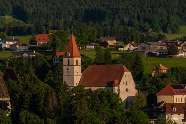 istock Semriach village with Schockl hill over in sunset sunny evening 1332182800