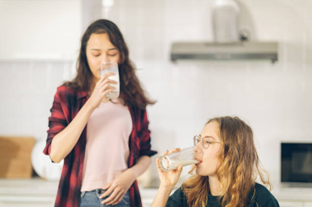 istock Two women are drinking in the kitchen 1332184180