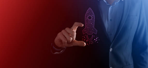 istock An empty workpiece. A businessman in a suit on a black background holds his hands protective gesture. A gesture of care and patronage. 1332185166