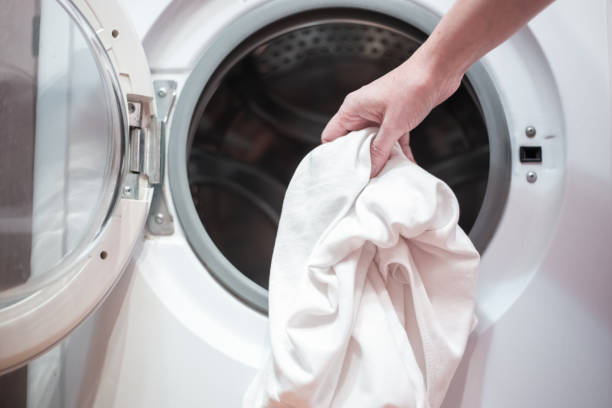 istock open door of the washing machine with linen 1332186882