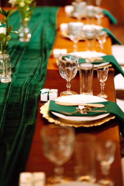 istock Banquet Seating Table in the restaurant in emerald color 1332188424