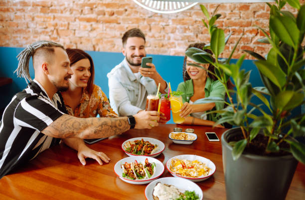 istock Happy friends having a great time in cafe. 1332188799