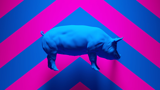 Pink pig made of plastic on blue background