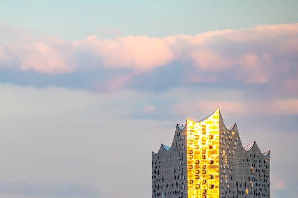 Hamburg, Germany - October 13. 2020: The facade of the Hamburg Elbphilharmonie shines in the evening sun. In addition to the concert hall, the opera house also includes apartments, offices and a hotel.