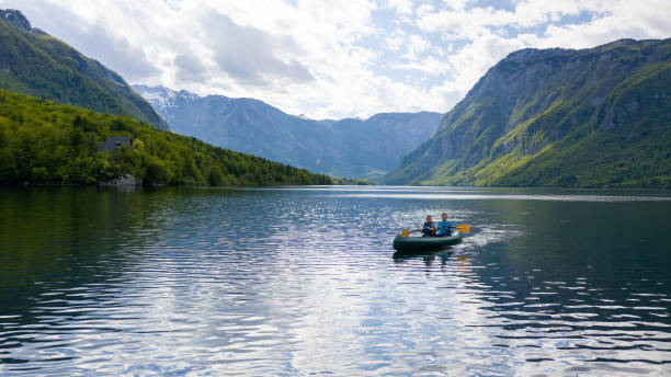 istock Kayakers paddling toward a mountain 1332198343
