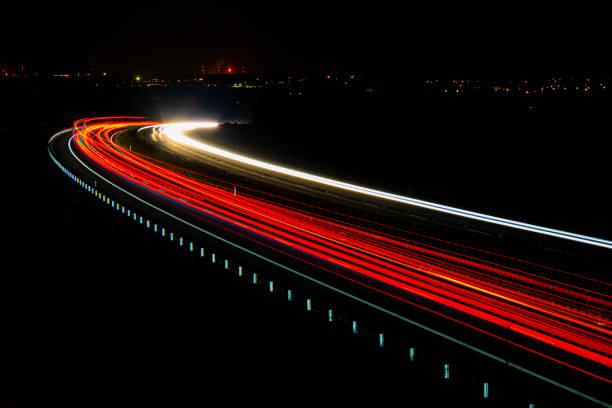 istock lights of cars with night. 1332199579