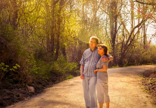 Old couple holding hands together, concept of old age, diseases of the joints and spine