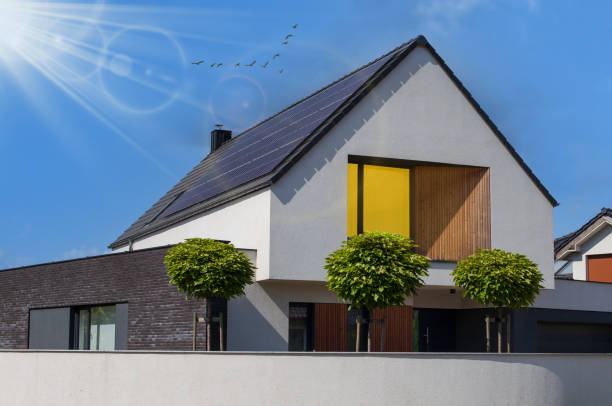 istock Modern house with solar panels and pool. Clear sky and ray sun. 1332204302