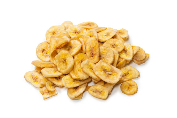 istock Banana chips isolated on a white background. Dehydrated banana. 1332205695