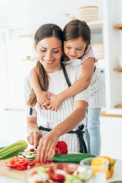 istock Mother and daughter in the kitchen 1332212218