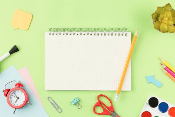 istock Notebook with pencil and school supplies 1332212945