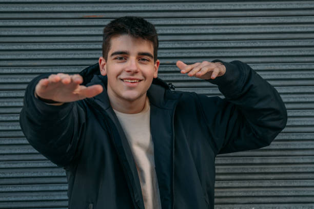 istock smiling young man outdoors, millennial 1332213104