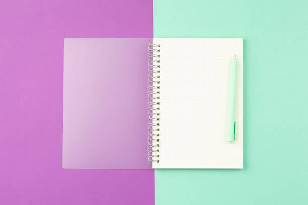istock Open notepad with pen and plant in the pot 1332213193