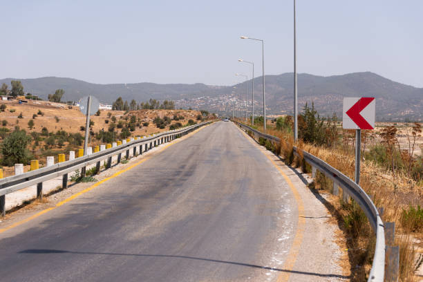 istock Country road without vehicles on daylight. 1332219841