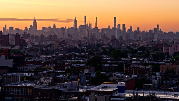istock Peach Sunset Behind New York Skyline - Drone Shot 1332220666