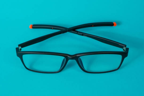 istock Anti-radiation glasses isolated on blue background 1332221741