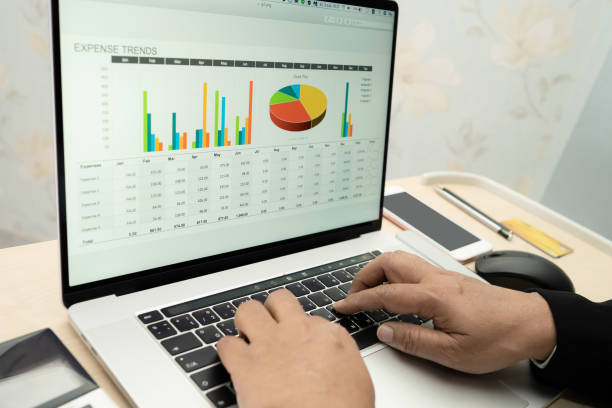 istock Asian accountant working and analyzing financial reports project accounting with chart graph and calculator in modern office, finance and business concept. 1332224666