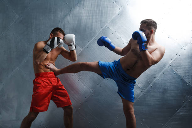 istock Two men boxers fighting muay thai boxing 1332225477