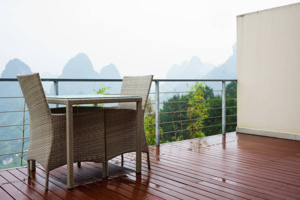 Two chairs and table on balcony with landscape view outside the handrail Two chairs and table on balcony with landscape view outside the handrail guilin hills stock pictures, royalty-free photos & images