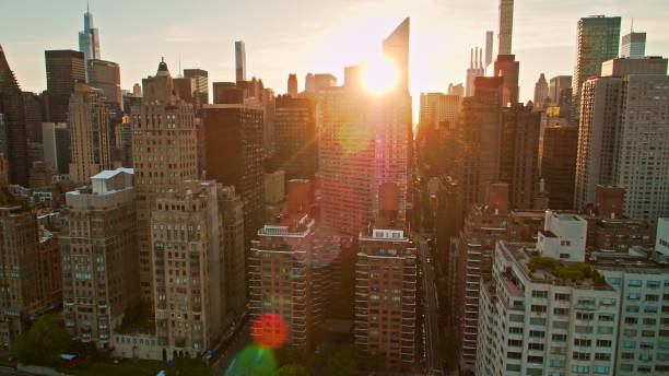 istock Sunset Behind Midtown Towers with Dramatic Lens Flare 1332231323
