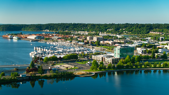 Aerial shot looking across Capitol Lake in Olympia, Washington, towards Downtown and the lumber yards in the Port of Olympia on the southern end of the Puget Sound.