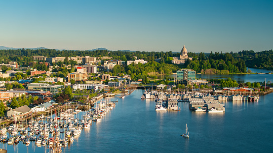 Aerial shot of Olympia, Washington on a summer evening, looking across the downtown towards the state capitol building.