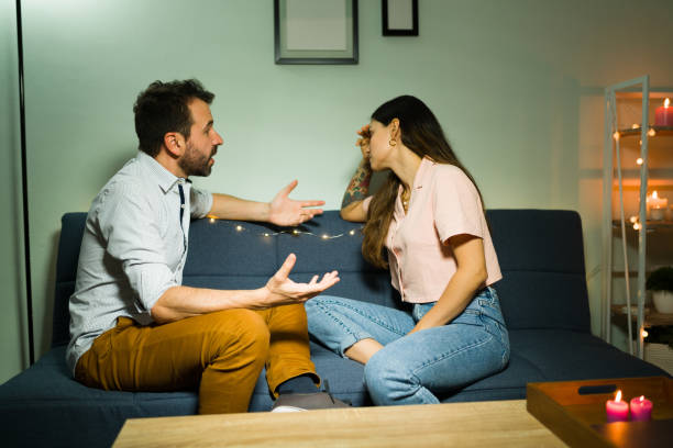 istock Upset husband and wife having a discussion 1332234068