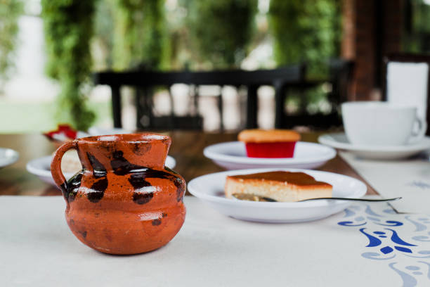https://media.istockphoto.com/id/1332241144/photo/caf%C3%A9-de-olla-served-in-jarrito-or-clay-cup-traditional-mexican-coffee-in-mexico.jpg?s=612x612&w=0&k=20&c=SgxjubbLK-q0FE5V5ctiNKqxiXySlfDaBrZpxFSPEcY=