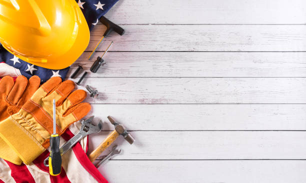 istock Happy Labor day concept. American flag with different construction tools on white wooden background. 1332242805