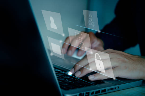 istock Businessman using computer laptop document management concept working with icons on a virtual screen. 1332246422