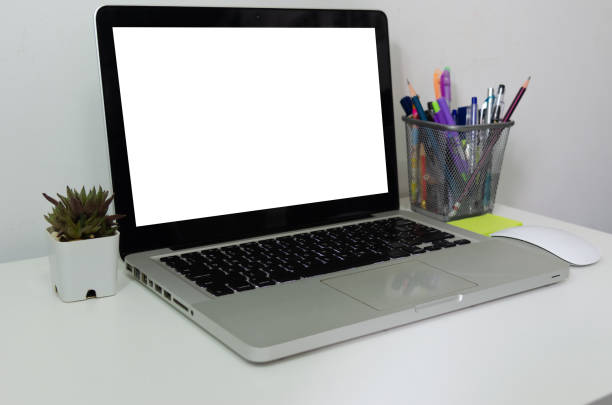 istock Computer laptop mock up blank white touch screen on desk. Used to put text or information to advertise news or sell products online. concept marketing business 1332246426