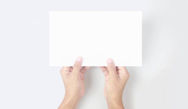 istock Hands holding paper blank for letter paper 1332251099