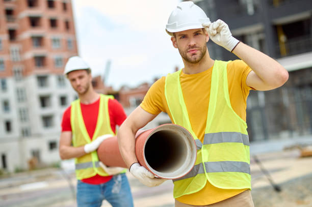 istock Two Caucasian loaders working on the building site 1332251258